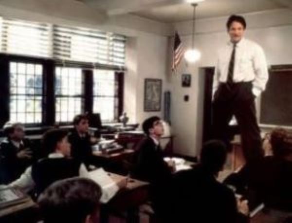 Robin Williams standing on a chair